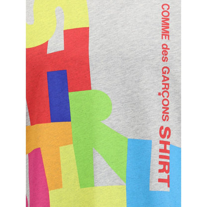 Comme Des Garçons Gray Cotton T-Shirt with multicolor print detail on the front.