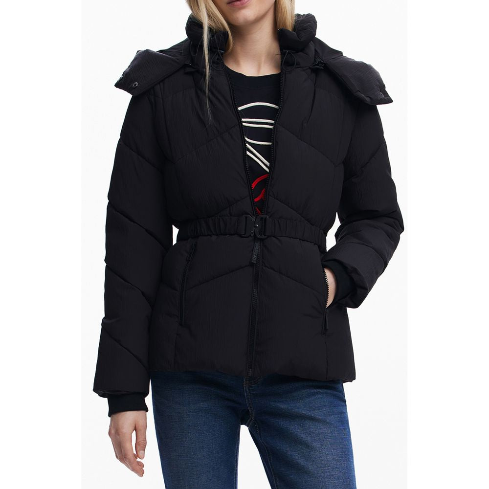 Woman wearing Desigual Black Polyester Women Jacket with removable hood and waist belt, showcasing both style and functionality.