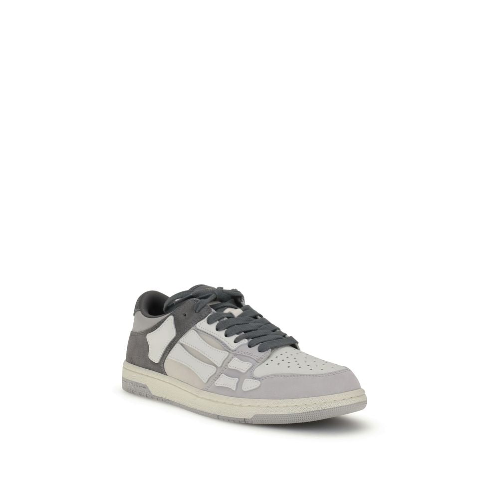 Amiri Gray Calf Leather Bos Taurus Low Top Sneakers with bone-shaped appliqués on two-tone rubber sole.