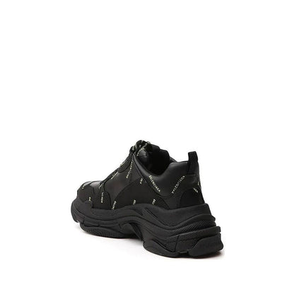 Balenciaga Black Calfskin Chunky Sneakers with logo detail, round toe, lace-up closure, rubber sole, and leather upper, rear view.
