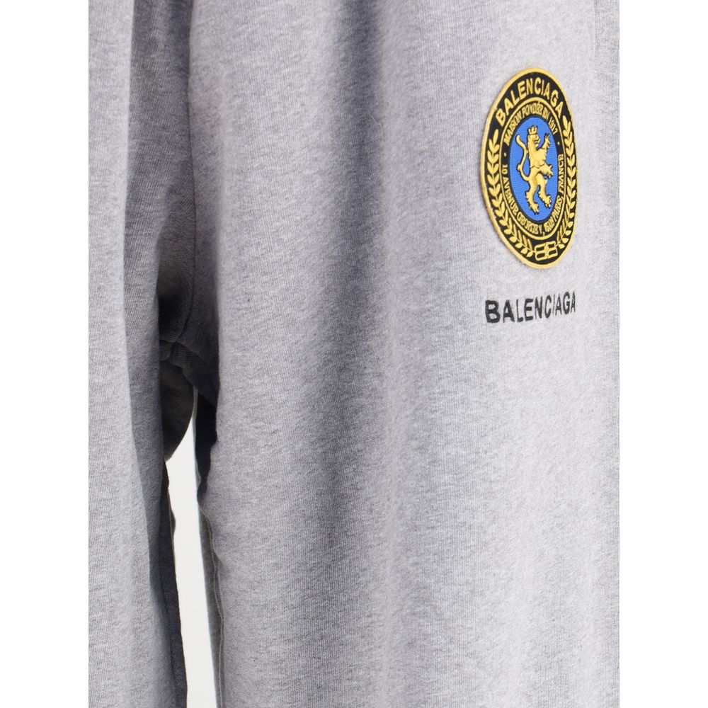 Balenciaga Gray Cotton Joggers with logo patch detail, featuring side view of fabric and signature branding.