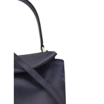 Close-up of Balenciaga Rodeo Small Shoulder Bag in used-effect leather highlighting the top handle and flap closure.