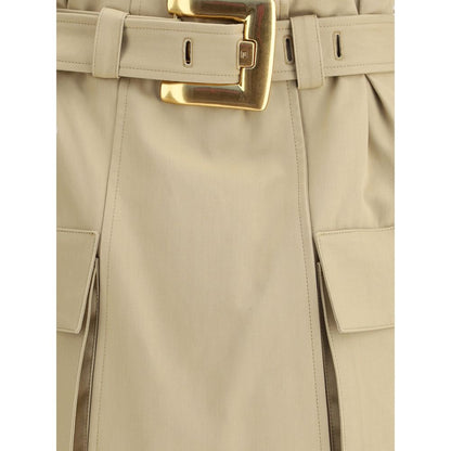 Detail of Balmain Beige Cotton Mini Skirt featuring gold metal buckle and pockets, showcasing iconic utility style.