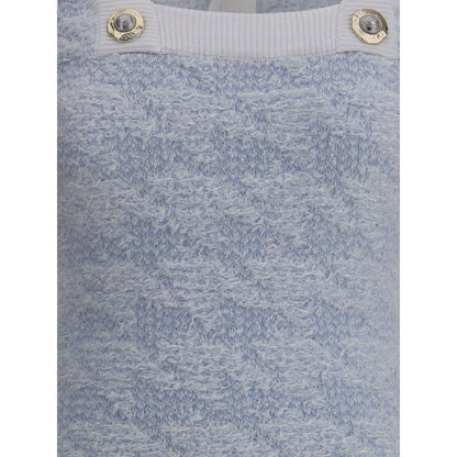 Close-up of Balmain Light Blue Polyamide Casual Dress with ribbed neckline and embossed button details, showcasing texture.