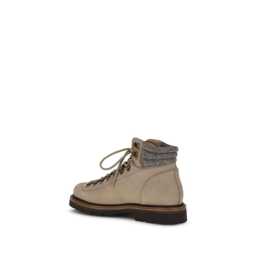 Side view of Brunello Cucinelli Beige Calf Leather Bos Taurus Lace-Up Boots with metal eyelets and round laces on a white background.