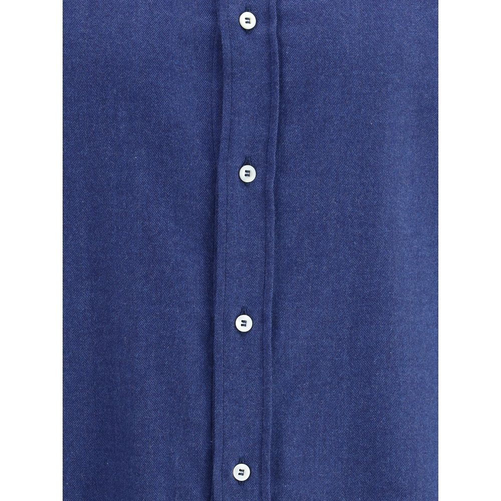 Front view of Brunello Cucinelli Blue Cotton Dress Shirt with button details and elegant monochrome pattern.