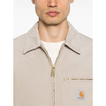 CARHARTT WIP MAIN Jackets Beige canvas jacket with zip-fastening chest pocket and press-stud cuffs, front view.