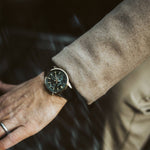 Gent wearing CASIO EDIFICE Mod. STANDARD CHRONOGRAPH GOLD - GREEN leather strap wristwatch, showcasing its elegant design.