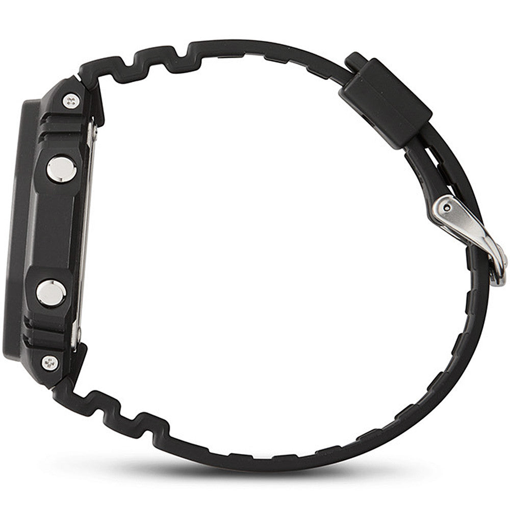 Side view of CASIO G-SHOCK Mod. OAK Black wristwatch with resin strap and carbon case, showcasing its rugged design and multifunction features.