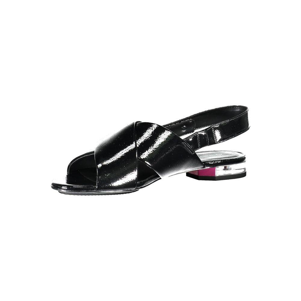Calvin Klein Black Leather Women Sandal with crossed front design and subtle 1cm heel offers minimalist chic and luxury appeal.