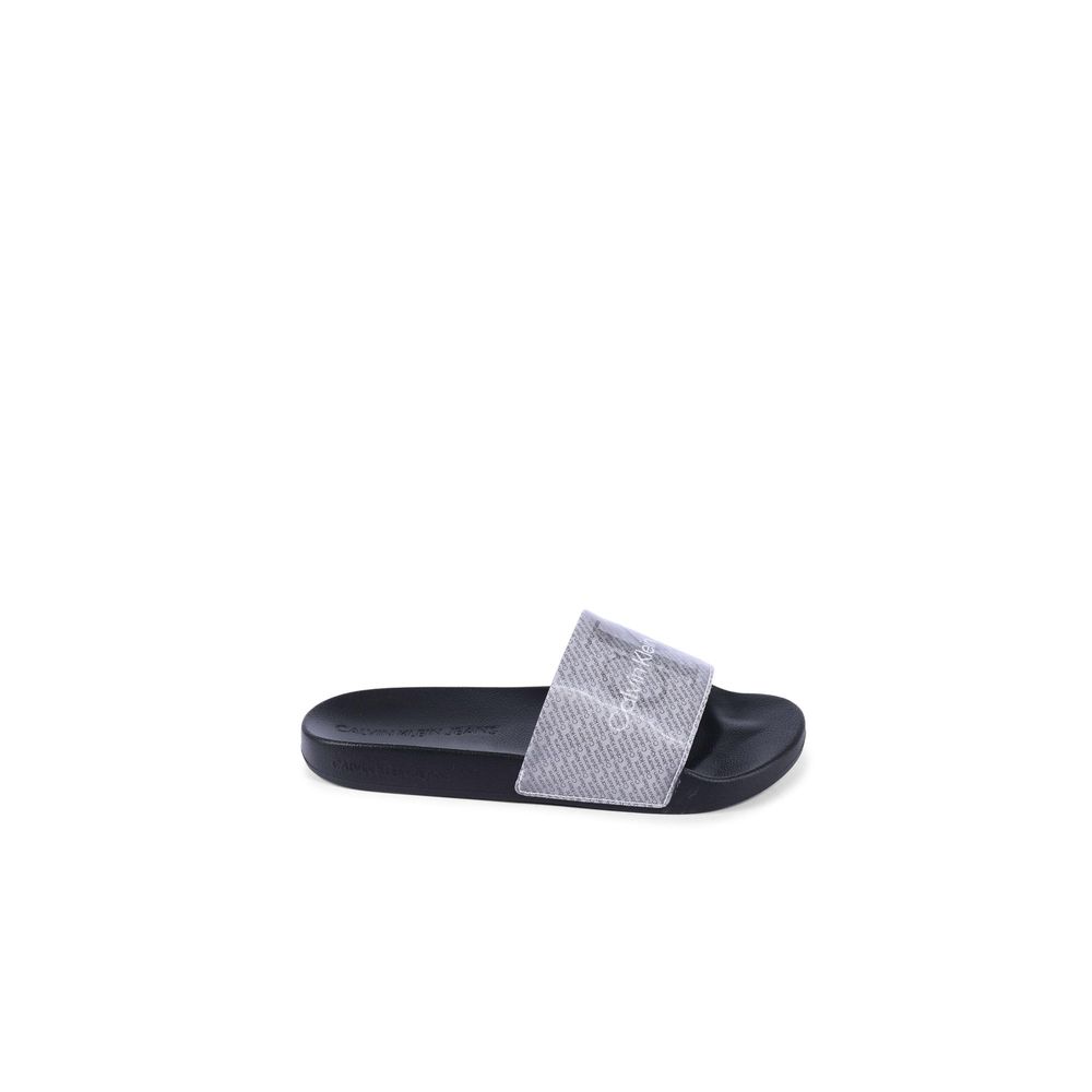 Alt Tag: Calvin Klein Black Polyurethane Sandals for women, featuring a sleek design in thermoplastic polyurethane, model YW0YW014030GN.