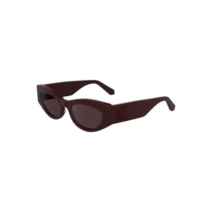 Calvin Klein Red Acetate Women Sunglasses with cat eye shape, eco-friendly design, chic red frames, and brown lenses for a bold statement.