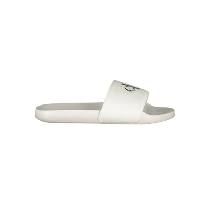 Calvin Klein White Polyester Women Sandal with logo-print, ideal for stylish poolside or city strolls, embodying contemporary chic elegance.