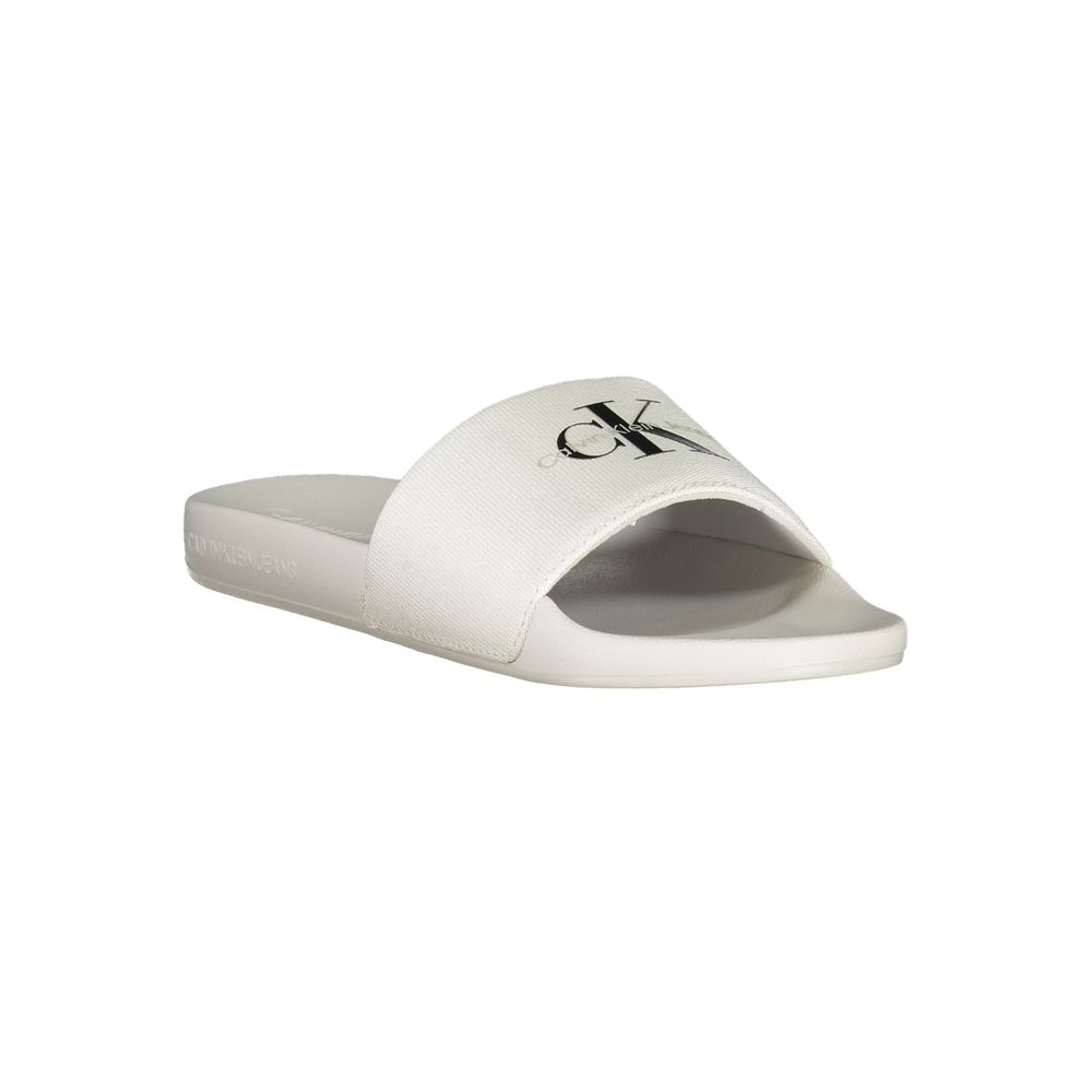 Calvin Klein White Polyester Women Sandal with logo-print, perfect for stylish poolside escape or city stroll, featuring iconic brand insignia.