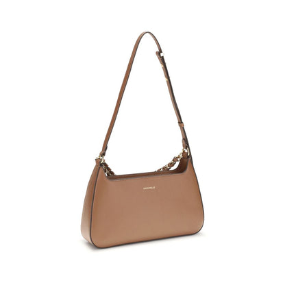 Coccinelle Beige Calf Leather Bos Taurus Shoulder Bag with gold chain, adjustable strap, and zip closure, elegant women's accessory.