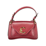 Coccinelle red leather handbag with gold hardware and elegant design.