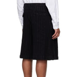 Back view of Comme Des Garçons Homme Plus Wool Shorts worn by a model