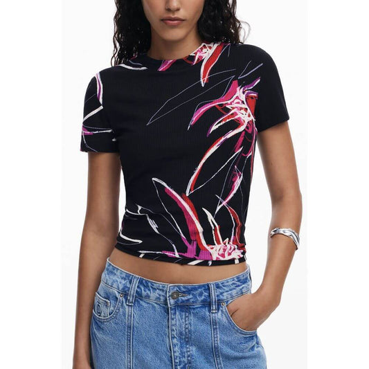 Model wearing Desigual Black Viscose Women Top with colorful print, showcasing short sleeves and crew neck style.