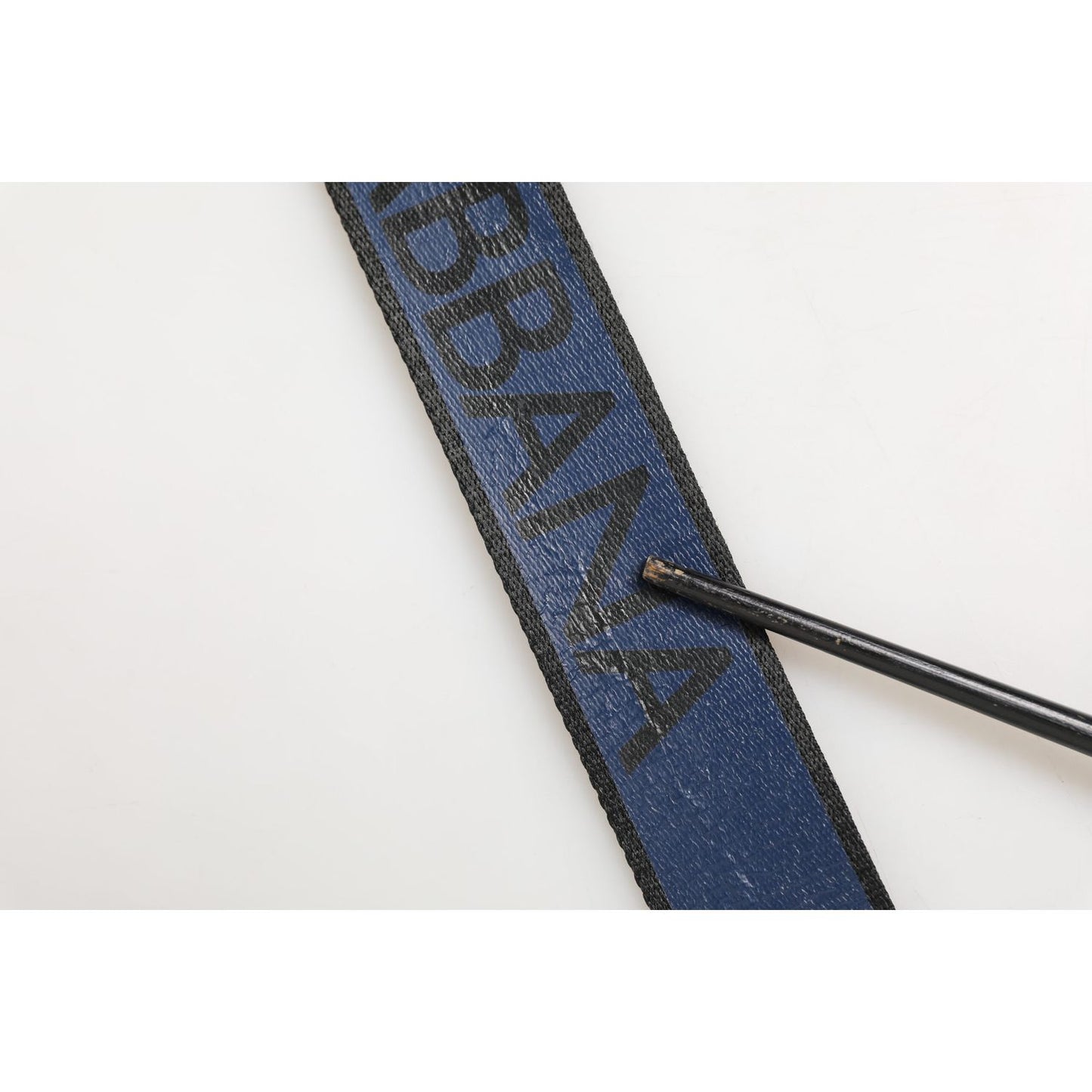 Close-up of Dolce & Gabbana Black Blue DG Logo Silver Metal Buckle Belt with peeling on printed logo.