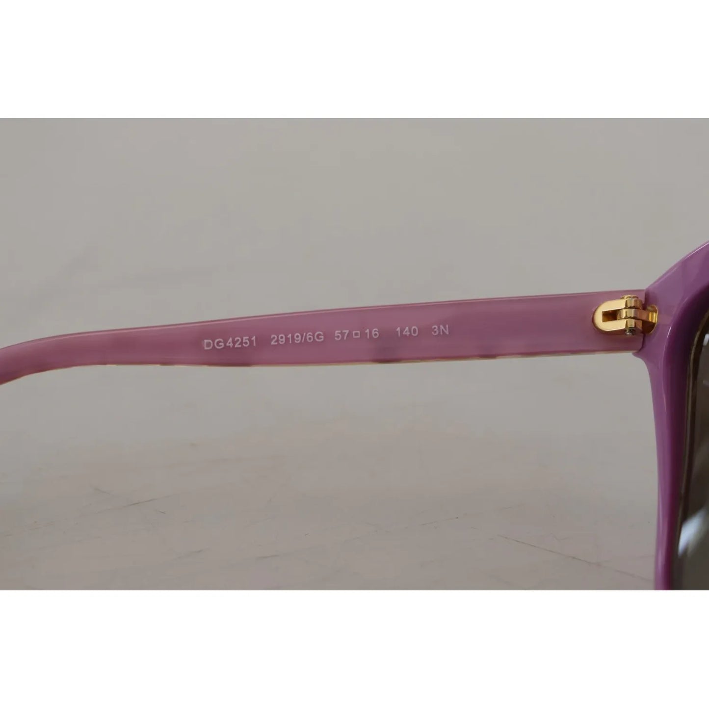 Close-up of Dolce & Gabbana DG4251 Pink Gold Full Rim Rectangle Frame Shades, showing violet pink acetate detail and gold accents.