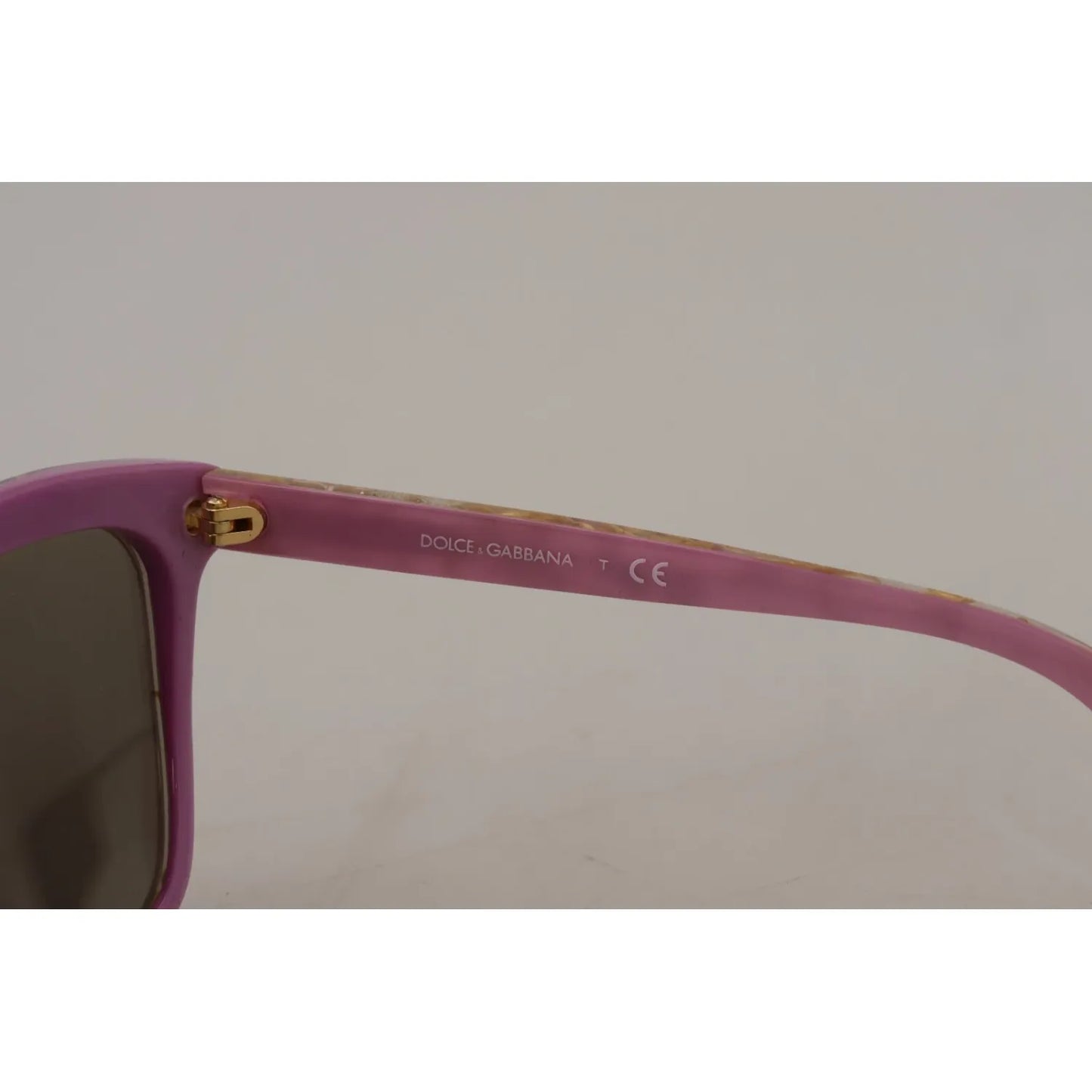 Close-up of Dolce & Gabbana DG4251 Violet Full Rim Rectangle Frame Shades with visible scratches on brown lenses.