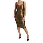 Dolce & Gabbana Gold Metallic Stretch Bodycon Ruched Dress with minor fabric pulls, shown on a model, featuring zipper closure.