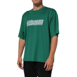Dolce & Gabbana Green Cotton Graphic Logo Print Crewneck T-shirt on model, showing short sleeves and bold logo design.
