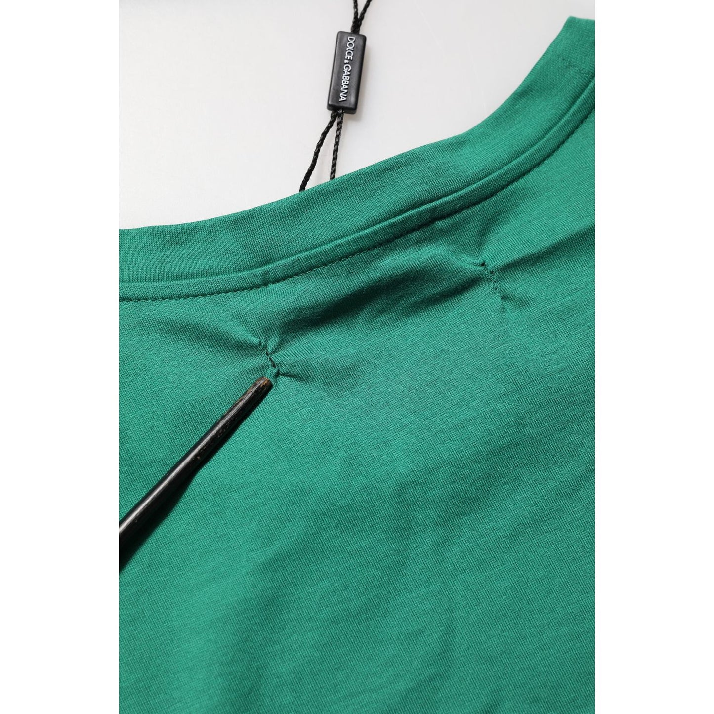 Close-up of Dolce & Gabbana Green Cotton Graphic Logo Print Crewneck T-shirt, highlighting fabric details and craftsmanship.