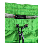 Dolce & Gabbana Green Nylon Drawstring Men Shorts Swimwear with elastic waistband and logo detailing, perfect for beachwear.