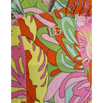 Close-up of Dolce & Gabbana Multicolor Floral Silk Flared Mini Dress with vibrant patterns and logo detail