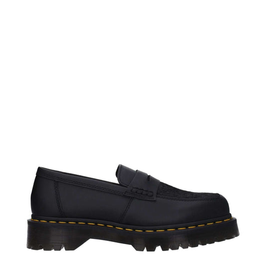 Dr. Martens Black Leather Slip-On Loafers with rubber sole, mid heels, and square toe, casual style.