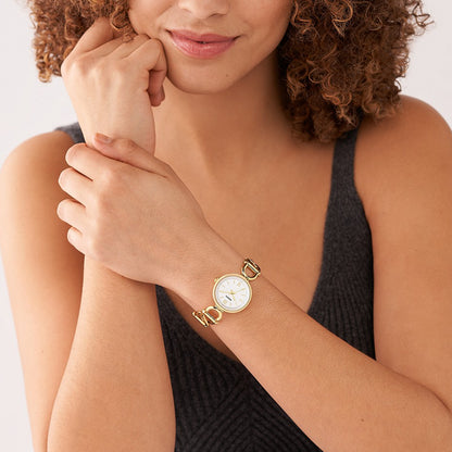 Woman wearing FOSSIL Mod. ES5272 wristwatch with gold SS IP case and strap, 30mm case, quartz movement, presented in official box.