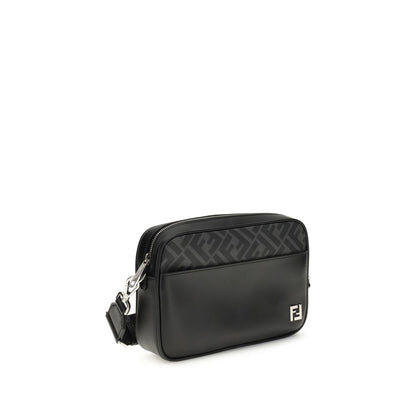 Fendi Black Leather Shoulder Bag with metal FF logo, featuring smooth leather and FF canvas, adjustable crossbody strap, and zippered compartment.