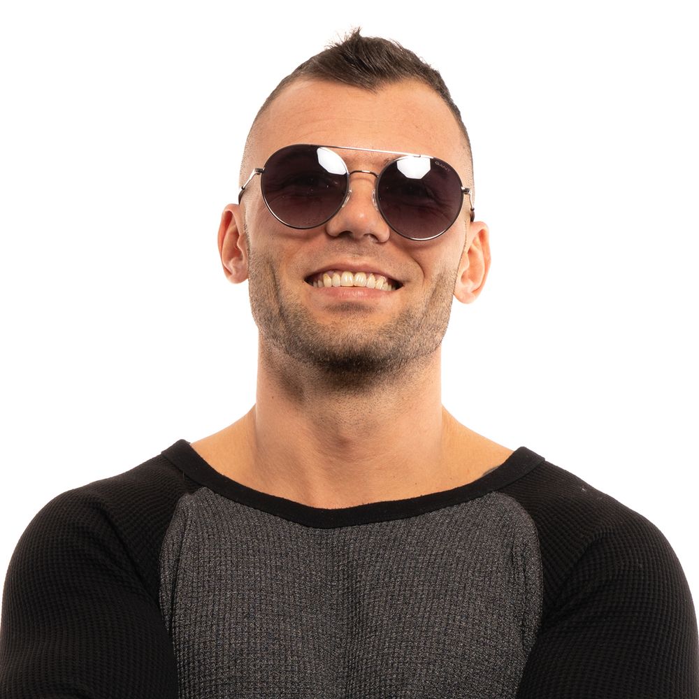 Gant Gray Men Sunglass on a person with short hair wearing a black and gray shirt. Aviator style with gunmetal frame and grey lenses.