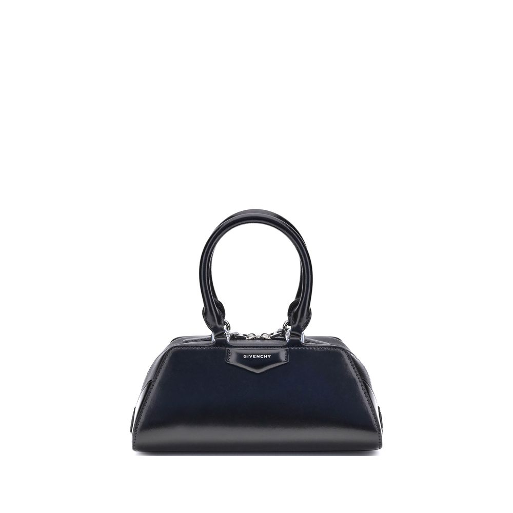 Givenchy Antigona East-West Mini Handbag with leather handles and embossed logo, showcasing elegant structured design.