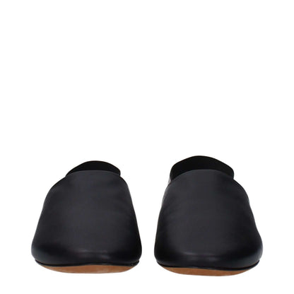 Front view of Givenchy Black Leather Slides with a round toe and low flat heel, featuring side and back logos.