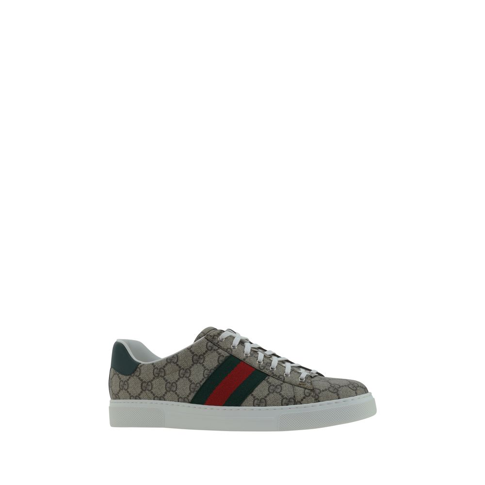 Alt Tag: Gucci Beige Rubber Low Top Sneakers with iconic GG jacquard, leather logo detail, contrasting platform sole, and lace-up front.