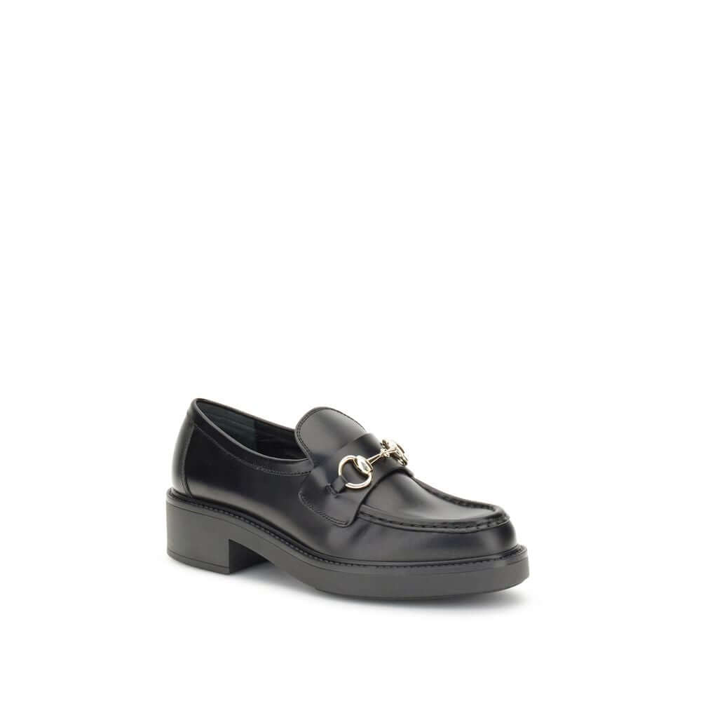 Gucci Black Calf Leather Bos Taurus Slip-On Loafers with iconic metal horsebit detail, round toe, and block heel for formal and everyday wear.