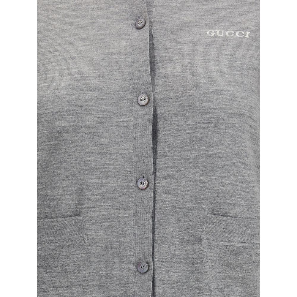 Gucci Gray Cashmere Cardigan with ribbed crew neck, buttons, patch pockets, and stitched logo, made of 70% cashmere and 30% wool.