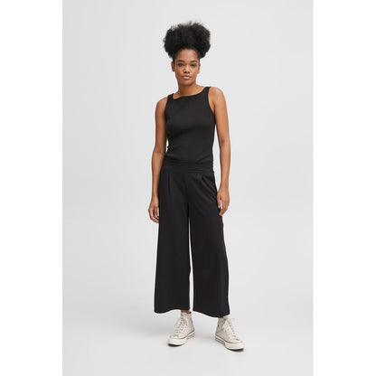 Woman wearing ICHI Black Recycled Polyester Flared Pants with a modern, comfortable design.