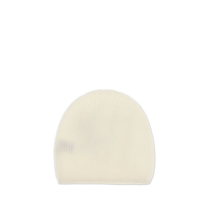 Cream cashmere beanie by Loulou De Saison, showcasing its ribbed texture and minimalist style for warmth and elegance in cold seasons.