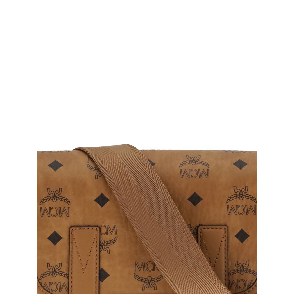 MCM Brown Fabric Shoulder Bag with logo print and structured design, showcasing craftsmanship and elegance.