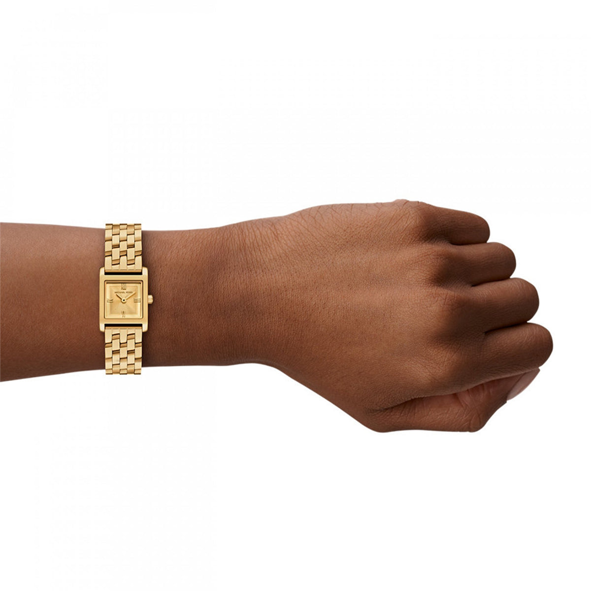 Close-up of gold watch on wrist showcasing luxury design.