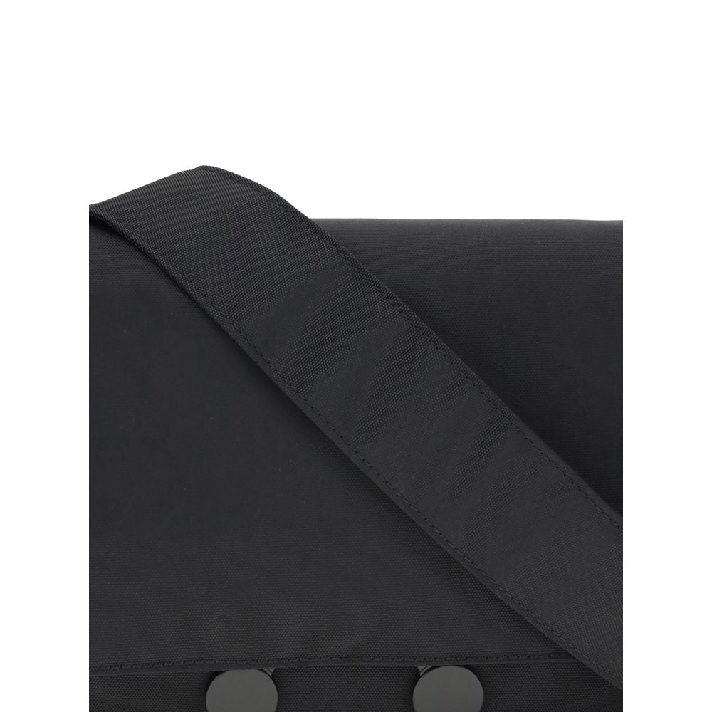 Close-up of Marni Black Polyamide Clutch Bag showing strap and buttons, highlighting the sleek urban design and durable material.