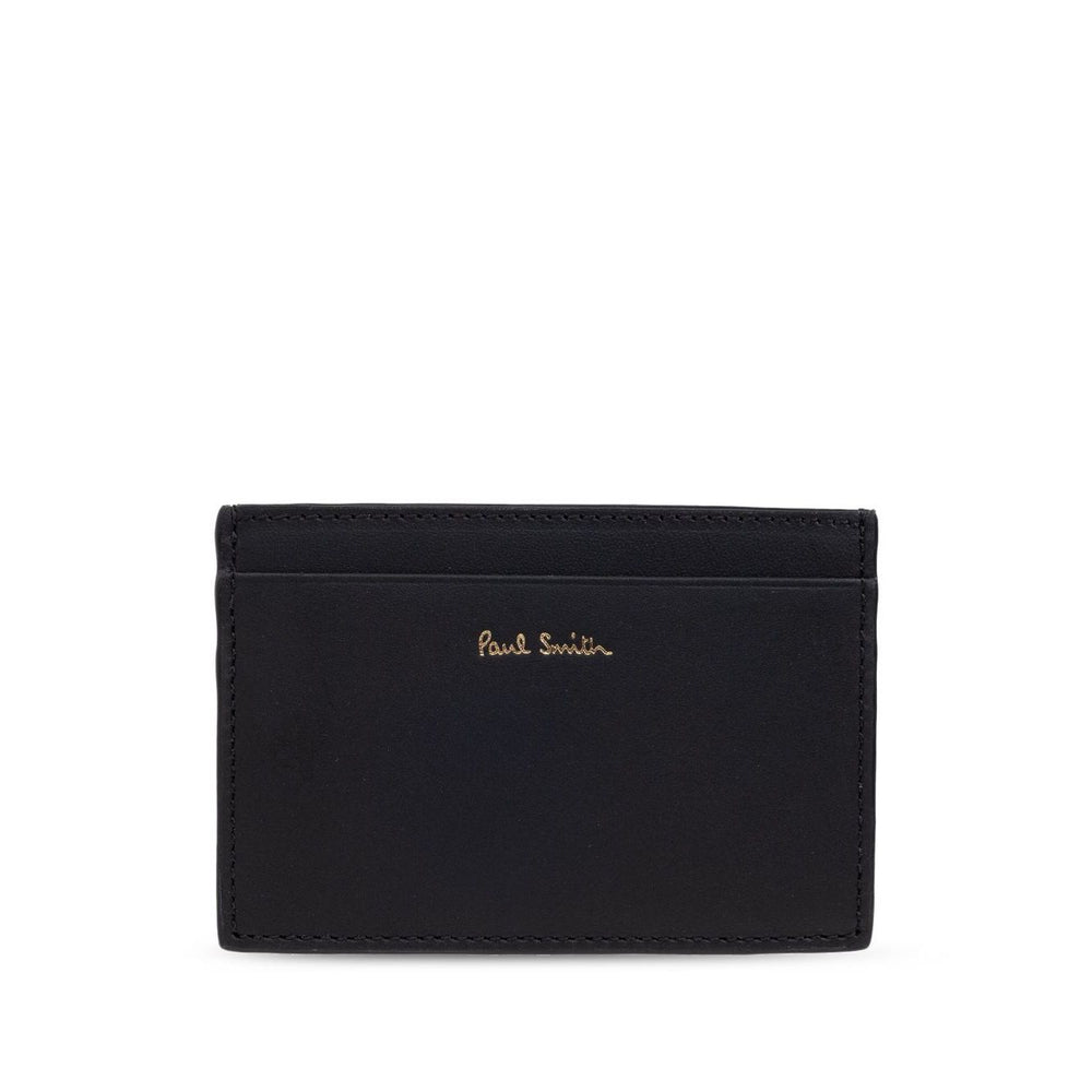 Paul Smith Signature Stripe leather card case with black card slots and logo stamp on the front.