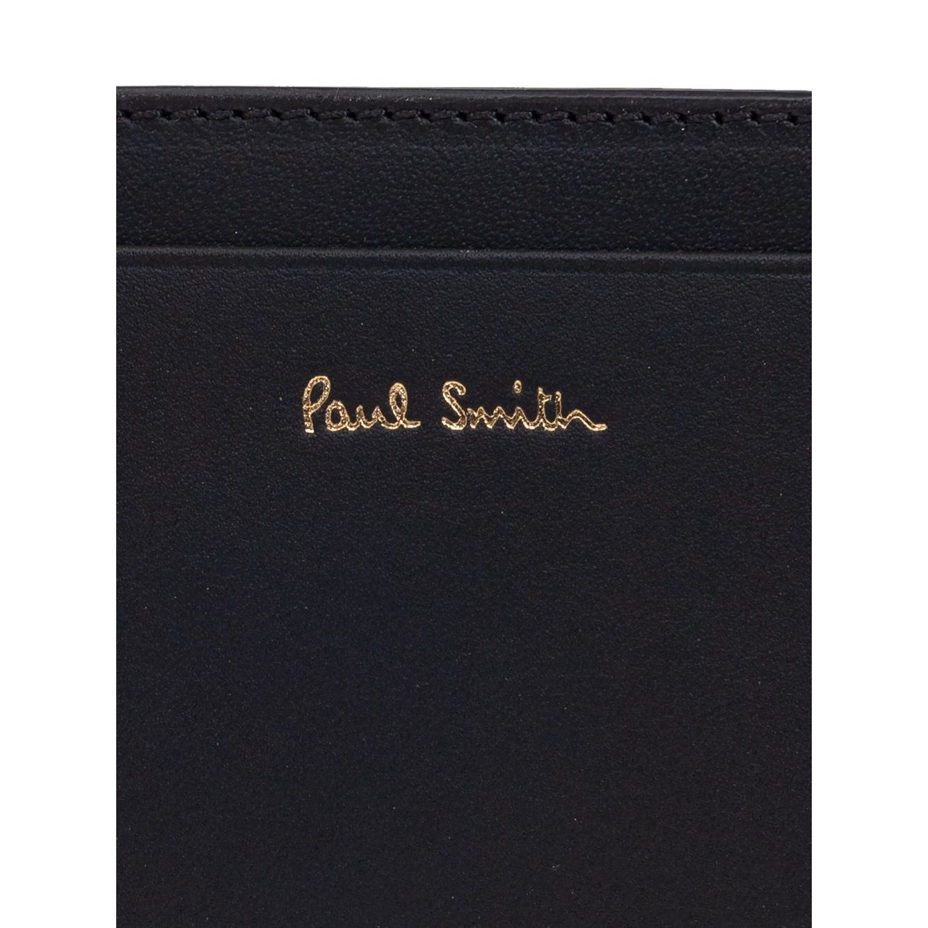 Paul Smith Signature Stripe leather card case with black card slots and logo stamp on the front, featuring a rectangle shape.