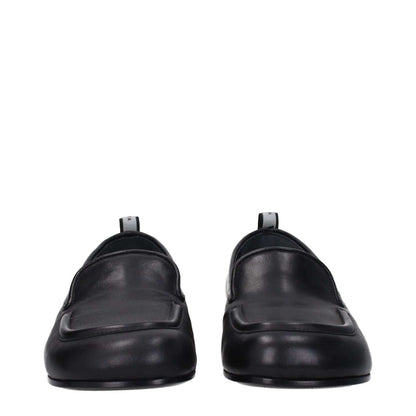 Premiata Black Leather Slip-On Loafers, round toe, low heel with back logo detail, front view.