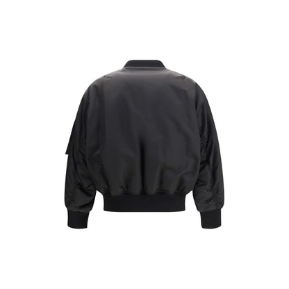Rear view of Saint Laurent Black Polyamide Bomber jacket with ribbed trim and baseball collar, showcasing oversize fit and sleek design.