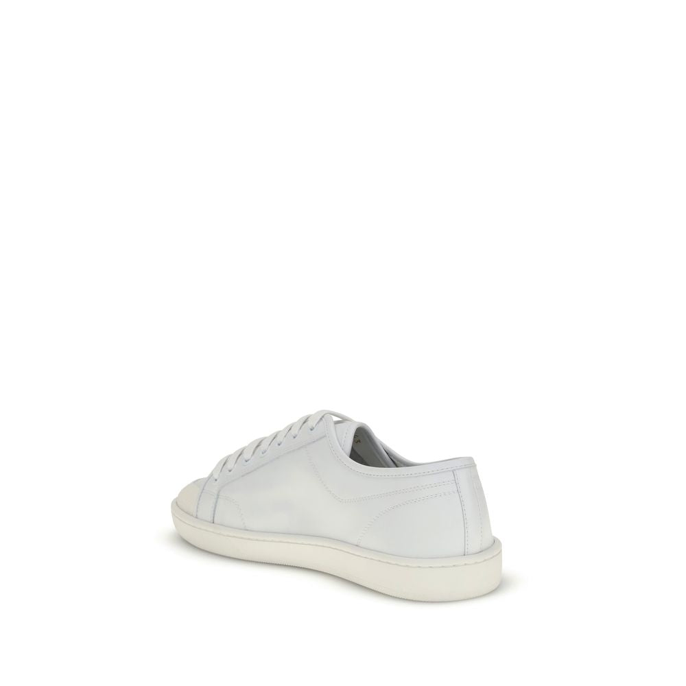 Side view of Saint Laurent White Calf Leather Bos Taurus Low Top Sneakers with lace-up closure and flat rubber sole for AW25 collection.