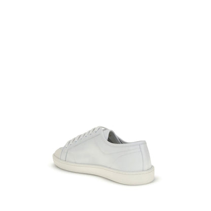 Side view of Saint Laurent White Calf Leather Bos Taurus Low Top Sneakers with lace-up closure and flat rubber sole for AW25 collection.